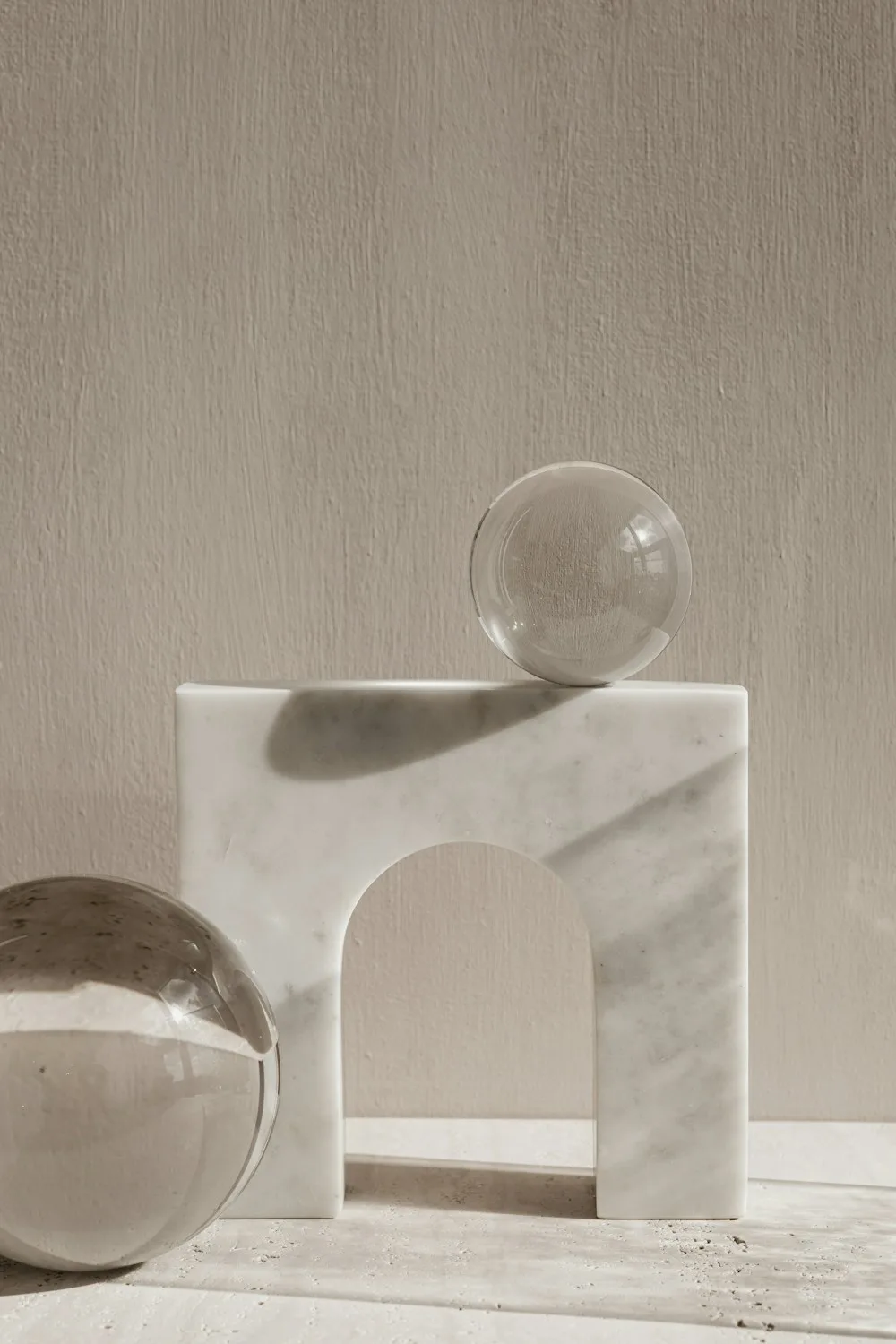 A marble arch with glass spheres